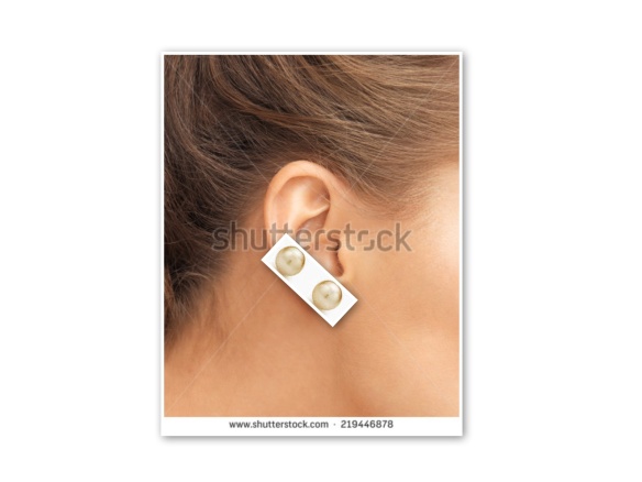 Two pearl earrings on one lobe